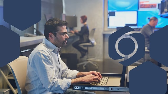 Photo of a SOC analyst working on a server