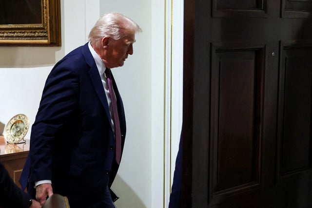 U.S. President Donald Trump leaves, following a cabinet meeting, at the White House in Washington, D.C., U.S., August 26, 2025.