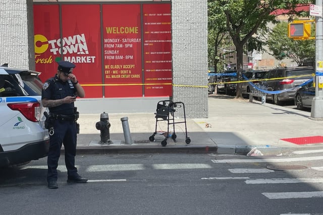 A walker is left at the scene of a shooting at East 110th Street and Madison Avenue in East Harlem on Aug. 27, 2025.