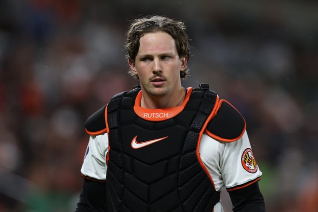 BALTIMORE, MARYLAND - SEPTEMBER 17: Adley Rutschman #35 of the Baltimore Orioles looks on after catching against the San Francisco Giants at Oriole Park at Camden Yards on September 17, 2024 in Baltimore, Maryland.