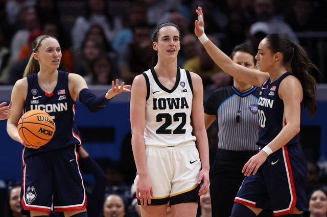 Caitlin Clark #22 of the Iowa Hawkeyes and Paige Bueckers #5 of the UConn Huskies react in the second half during the NCAA Women's Basketball Tournament Final Four semifinal game at Rocket Mortgage Fieldhouse on April 05, 2024 in Cleveland, Ohio.