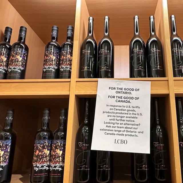 A sign is posted on a wine shelves at an LCBO, the government-run liquor stores where most wine and spirits in the province are purchased, Sunday, March 9, 2025, in Toronto. (AP Photo/Jill Colvin)