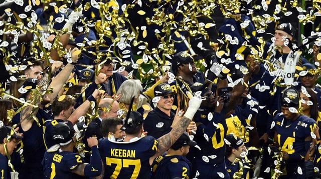 Jan 8, 2024; Houston, TX, USA; Michigan Wolverines head coach Jim Harbaugh holds the National Championship Trophy as he celebrates after winning 2024 College Football Playoff national championship game against the Washington Huskies at NRG Stadium. Mandatory Credit: Maria Lysaker-Imagn Images