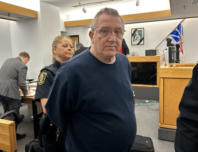 Anthony Humby is led out of a provincial court room in St. John's, N.L., on March 19, 2025. THE CANADIAN PRESS/Sarah Smellie