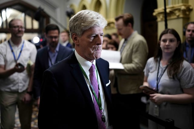 Minister of Energy and Natural Resources Tim Hodgson arrives for a meeting of the federal cabinet in West Block on Parliament Hill in Ottawa on Wednesday, May 14, 2025. THE CANADIAN PRESS/Justin Tang