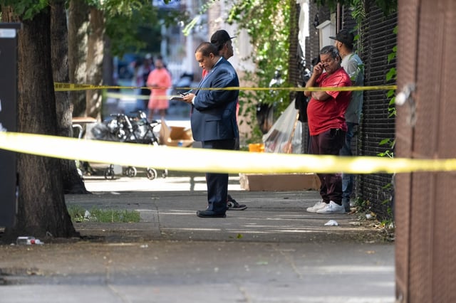 NYPD officers and detectives investigate a triple shooting at 1412 College Ave. in the Bronx Wednesday, Aug. 27, 2025. (Barry Williams / New York Daily News)