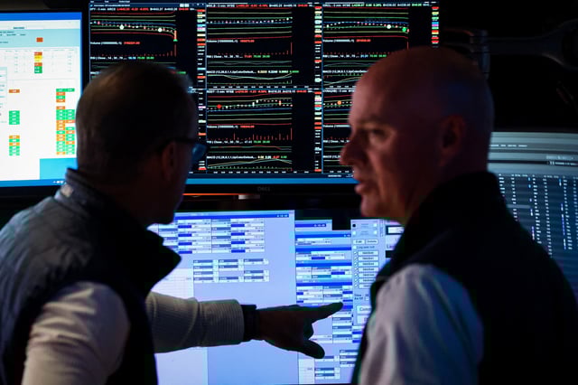 Traders work on the floor at the New York Stock Exchange (NYSE) in New York City, U.S., August 26, 2025. REUTERS/Brendan McDermid