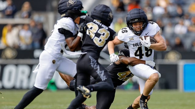 Colorado Buffaloes running back Christian Sarem (48) is tackled by inside linebacker Jeremiah Brown (42) as wide receiver Quentin Gibson (15) defends against cornerback Kole Mathis (33) during the spring game at Folsom Field. Mandatory Credit: Isaiah J. Downing-Imagn Images