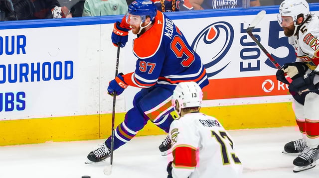 Jun 14, 2025; Edmonton, Alberta, CAN; Edmonton Oilers center Connor McDavid (97) skates with the puck against the Florida Panthers during the second period in game five of the 2025 Stanley Cup Final at Rogers Place. Mandatory Credit: Sergei Belski-Imagn Images