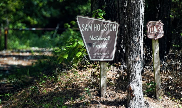 A sign for Sam Houston National Forest inside Flamingo Lakes neighborhood in Montgomery, Texas on Monday, Oct. 4, 2021.