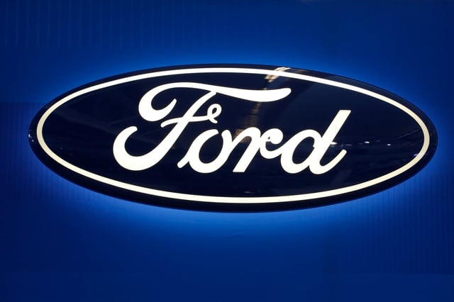 This Feb. 11, 2016 photo shows the Ford logo on display at the Pittsburgh International Auto Show in Pittsburgh.  Ford is recalling about 830,000 vehicles in the U.S. and Mexico, on Thursday, Aug. 4, 2016,  because the side door latches can break and the doors can open while the vehicles are moving. The recall covers certain 2013 to 2015 Ford Escape SUVs and C-Max cars, and 2012 to 2015 Focus cars. Also included are 2014 to 2016 Ford Transit Connect vans, and Ford Mustang sports cars and Lincoln MKC SUVs from 2015.(AP Photo/Gene J. Puskar)