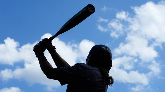 Jacqueline Reynolds swings during tryouts for the Women’s Professional Baseball League