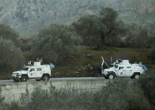 UN peacekeepers (UNIFIL) vehicles ride along a street in Marjaayoun, Southern Lebanon January 20, 2025. REUTERS/Mohamed Azakir/File Photo