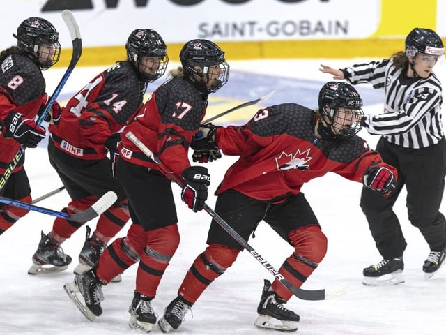  Canada’s Caitlin Kraemer, right, celebrates with, from left, Ava Murphy, Piper Grober, Emma Pais and Alex Law after scoring a goal against Sweden during the U18 world championship at Ostersund Arena in Ostersund, Sweden, on Jan. 15, 2023.