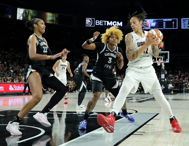 Brittney Griner #42 of the Atlanta Dream drives against A'ja Wilson #22 and NaLyssa Smith #3 of the Las Vegas Aces in the fourth quarter of their game at Michelob ULTRA Arena on August 19, 2025 in Las Vegas, Nevada. The Aces defeated the Dream 74-72.