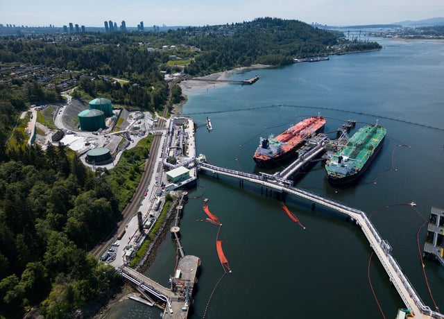 Crude oil tankers SFL Sabine, back left, and Tarbet Spirit are seen docked at the Trans Mountain Westridge Marine Terminal, where crude oil from the expanded Trans Mountain Pipeline is loaded onto tankers, in Burnaby, B.C., Monday, June 10, 2024. THE CANADIAN PRESS/Darryl Dyck