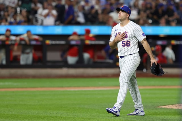 New York Mets pitcher Ryan Helsley walks to the dugout during the eighth inning of a baseball game against the Philadelphia Phillies, Tuesday, Aug. 26, 2025, in New York. (AP Photo/Pamela Smith)