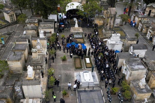 This aerial view shows the burial of Colombian presidential candidate Miguel Uribe at the Central Cemetery in Bogota, after being shot in the head at a campaign event