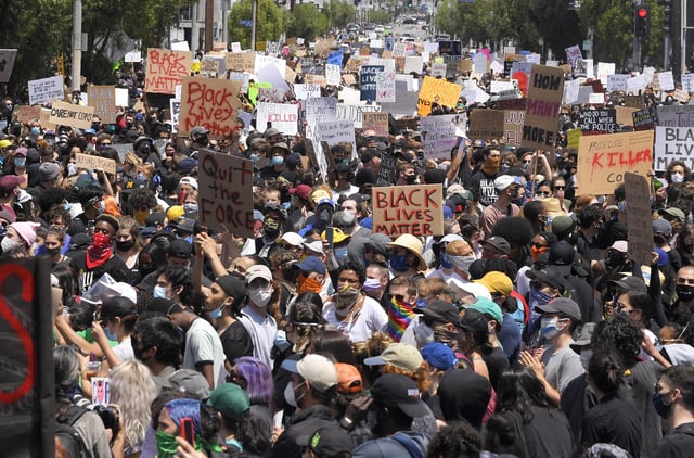 FILE - Demonstrators sit in an intersection during a protest over the death of George Floyd, on May 30, 2020, in Los Angeles. (AP Photo/Mark J. Terrill, File)