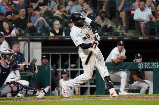 White Sox center fielder Luis Robert Jr. hits a home run against the Twins on Saturday, Aug. 23, 2025, at Rate Field. (David Banks/AP)