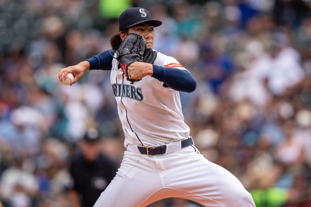 Aug 27, 2025; Seattle, Washington, USA; Seattle Mariners starter Bryan Woo (22) delivers a pitch during the first inning against the San Diego Padres at T-Mobile Park. Mandatory Credit: Stephen Brashear-Imagn Images