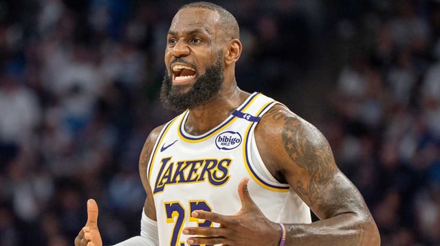 Apr 27, 2025; Minneapolis, Minnesota, USA; Los Angeles Lakers forward LeBron James (23) talks with his coach during a stoppage in play against the Minnesota Timberwolves in the second quarter during game four of first round for the 2025 NBA Playoffs at Target Center. Mandatory Credit: Matt Blewett-Imagn Images