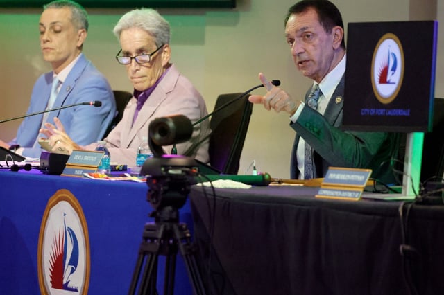 Mayor Dean Trantalis speaks during a special Fort Lauderdale commission meeting at the Broward Center for the Performing Arts on Wednesday, Aug. 27, 2025, as Commissioners Ben Sorensen, left, and Steven Glassman look on. The meeting was held to discuss a letter from the Florida Department of Transportation requiring the removal of rainbow and other street art in the city. (Amy Beth Bennett/South Florida Sun Sentinel)