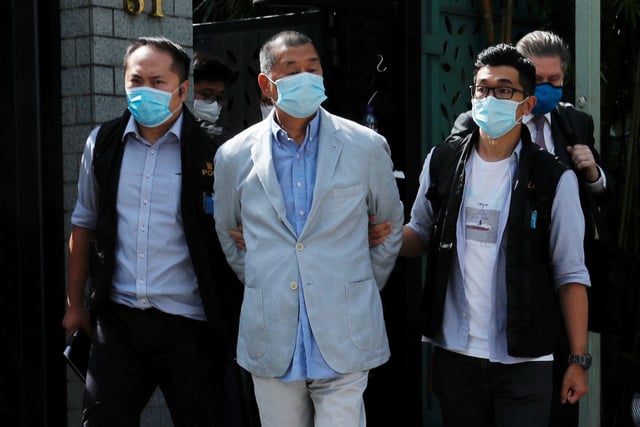 Media mogul Jimmy Lai Chee-ying, founder of Apple Daily (C) is detained by the national security unit in Hong Kong, China August 10, 2020.