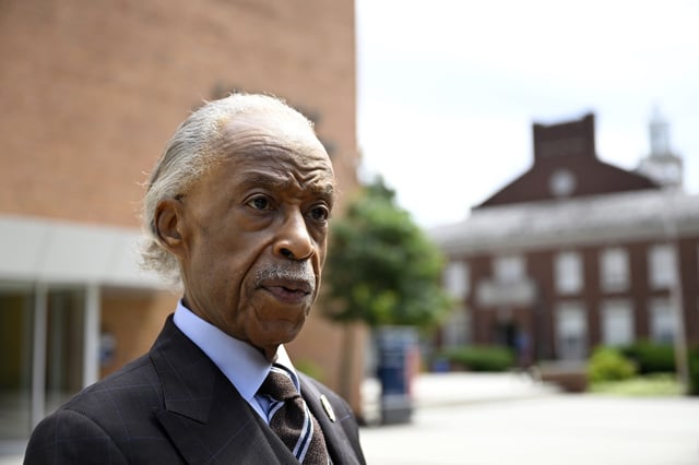 Rev. Al Sharpton speaks with reporters after delivering a sermon at Howard University's Cramton Auditorium, Sunday, Aug. 24, 2025, in Washington, to announce a national drive in support of District of Columbia Mayor Muriel Bowser, as President Donald Trump's administration continues it's use of federal law enforcement and National Guard troops in the city. (AP Photo/John McDonnell)