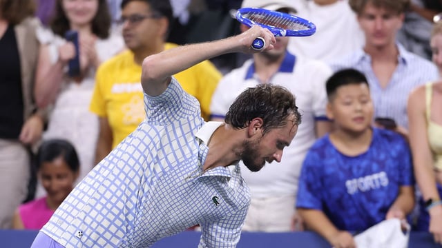 A frustrated Daniil Medvedev smashes his racket towards the end of his first round loss vs Benjamin Bonzi.
