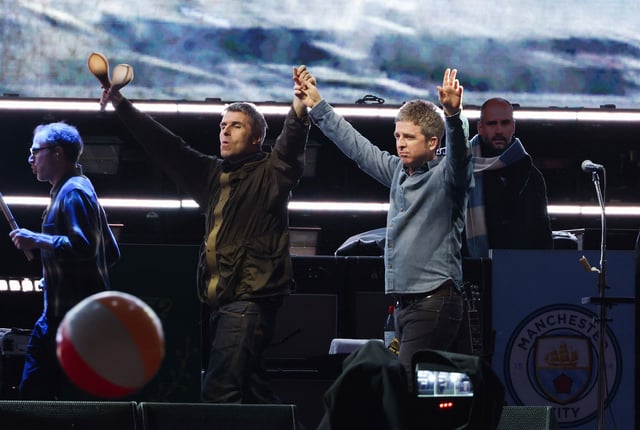 Liam and Noel Gallagher onstage in Toronto on Sunday, another drama-free stop in their once-unthinkable reunion tour.
