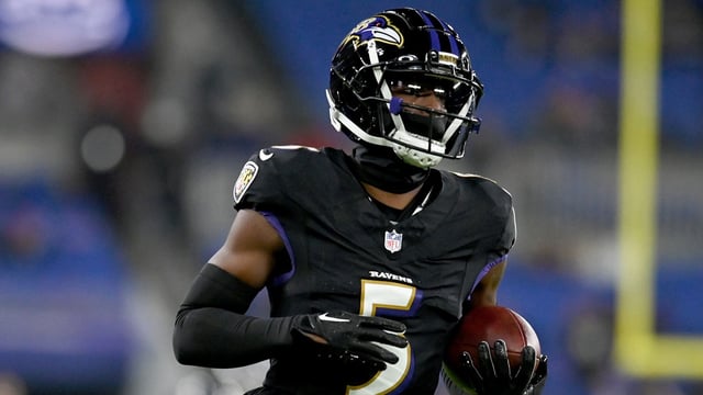 Nov 16, 2023; Baltimore, Maryland, USA; Baltimore Ravens cornerback Jalyn Armour-Davis (5) warms up before a game against the Cincinnati Bengals at M&T Bank Stadium. Mandatory Credit: Tommy Gilligan-Imagn Images