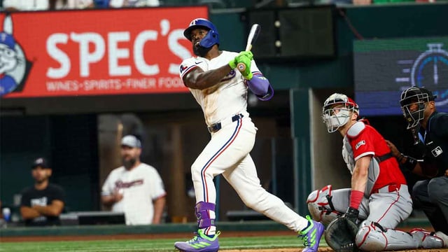 Aug 27, 2025; Arlington, Texas, USA; Texas Rangers right fielder Adolis Garcia (53) hits a two-run double during the seventh inning against the Los Angeles Angels at Globe Life Field. Mandatory Credit: Kevin Jairaj-Imagn Images