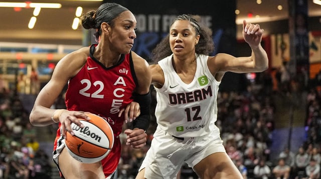 Aug 27, 2025; College Park, Georgia, USA; Las Vegas Aces center A'ja Wilson (22) dribbles against Atlanta Dream forward Nia Coffey (12) during the first half at Gateway Center Arena at College Park. Mandatory Credit: Dale Zanine-Imagn Images
