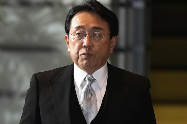 FILE - Ryosei Akazawa, newly appointed Minister in charge of Economic Revitalization, arrives at the prime minister's office in Tokyo, on Oct. 1, 2024. (AP Photo/Hiro Komae, File)