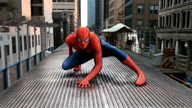Spider-Man on top of a train.
