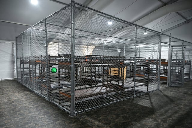 Beds are seen inside a migrant detention center, dubbed "Alligator Alcatraz," located at the site of the Dade-Collier Training and Transition Airport, as US President Donald Trump toured the facility in Ochopee, Florida on July 1, 2025.