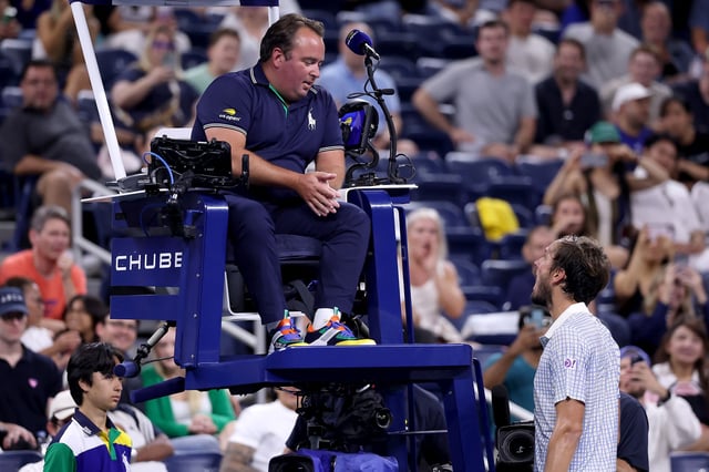 Medvedev (right) argues with chair umpire Greg Allensworth (left) during the first round match at the US Open between Medvedev and Bonzi.