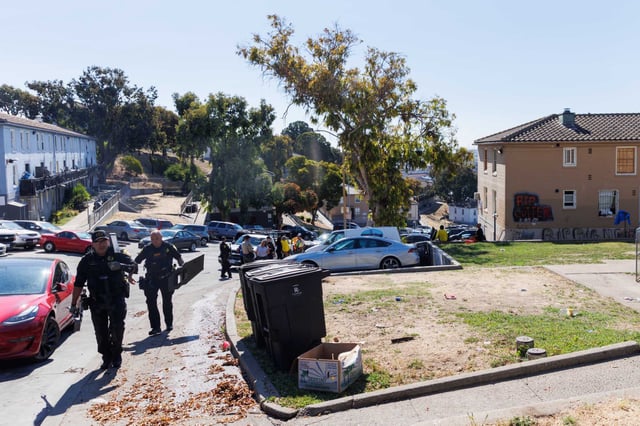 Officers from the sheriff’s department leave a unit at Potrero Annex after attempting to evict a tenant in San Francisco in 2024. The city has offered $5,000 Airbnb gift cards to some of the residents, who it says are living there illegally, if they depart.