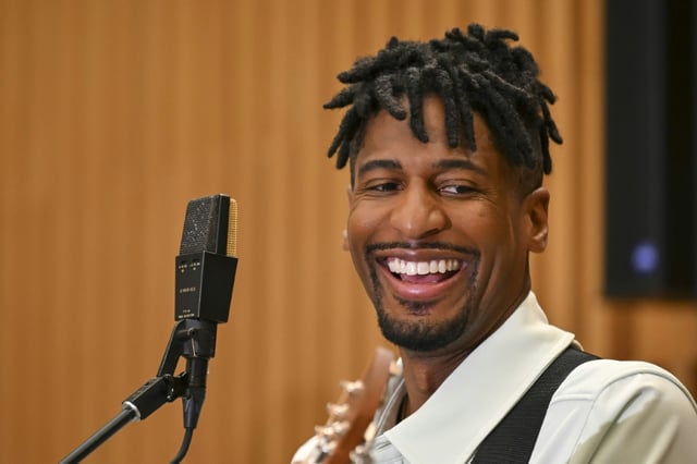 US musician Jon Batiste says Hurricane Katrina's impact on his hometown of New Orleans should be a wake-up call about climate change