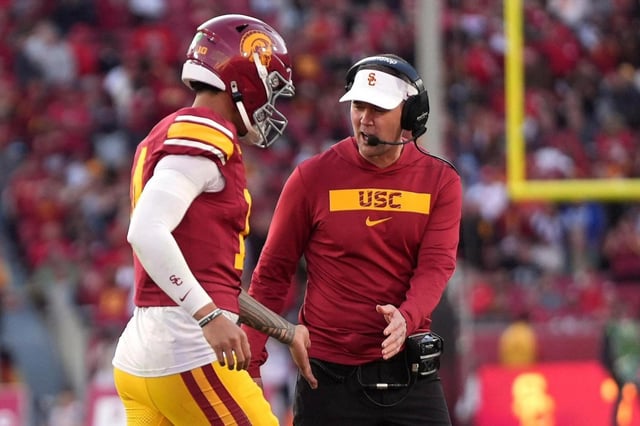 Southern California coach Lincoln Riley congratulates quarterback Jayden Maiava after Maiava ran the ball in for a touchdown during the second half against Nebraska on Nov. 16, 2024, in Los Angeles. (AP Photo/Mark J. Terrill)