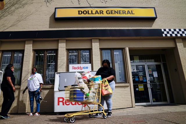 A person exits a Dollar General store in Mount Rainier, Maryland, U.S., June 1, 2021. REUTERS/Erin Scott/File Photo