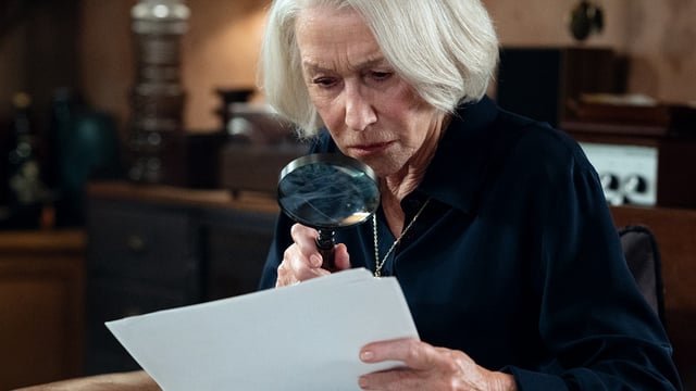 Helen Mirren looking for clues in The Thursday Murder Club.