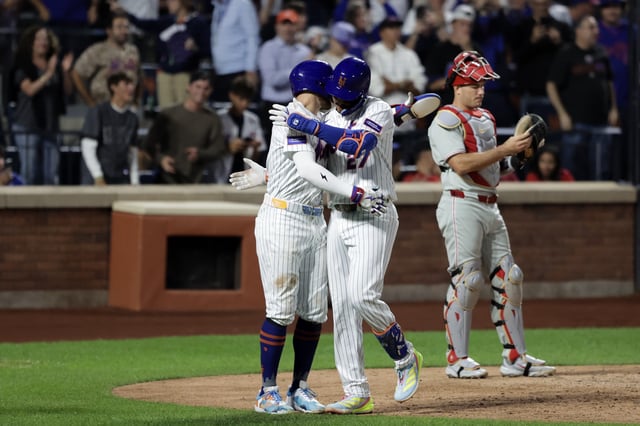 NEW YORK, NEW YORK - AUGUST 27: Mark Vientos #27 of the New York Mets hugs Brandon Nimmo #9 of the New York Mets after hitting a home run in the seventh inning against the Philadelphia Phillies at Citi Field on August 27, 2025 in New York City. (Photo by Kent J. Edwards/Getty Images)