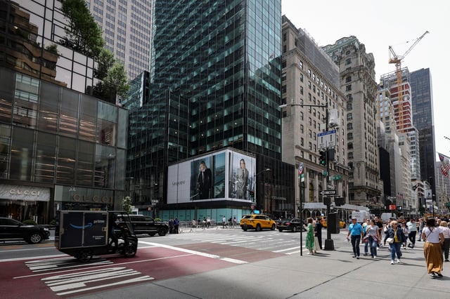 Pedestrians walk past a retail space at 715-717 Fifth Avenue in New York City, U.S., May 27, 2025. REUTERS/Jeenah Moon/File Photo