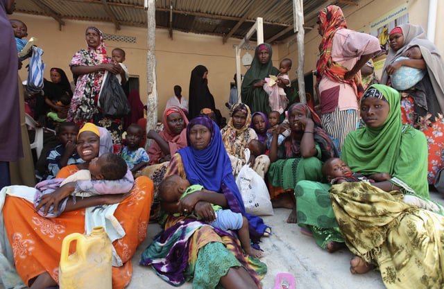 Internally displaced Somali women wait for medicine at a Save the Children UK clinic at their camp in Hodan district of Somalia's capital Mogadishu, November 21, 2012. REUTERS/Feisal Omar/File Photo