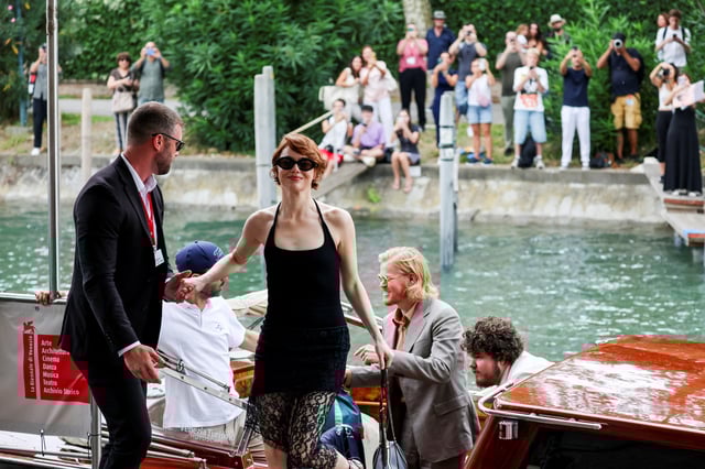 Emma Stone and Jesse Plemons arrive by a taxi boat at the 82nd Venice Film Festival, in Venice, Italy, August 28, 2025. REUTERS/Yara Nardi