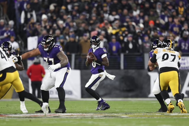 BALTIMORE, MARYLAND - JANUARY 11: Lamar Jackson #8 of the Baltimore Ravens looks to make a pass during a Wild Card Playoff Game against the Pittsburgh Steelers at M&T Bank Stadium on January 11, 2025, in Baltimore, Maryland. The Ravens defeated the Steelers 28-14. (Kara Durrette/Getty Images)