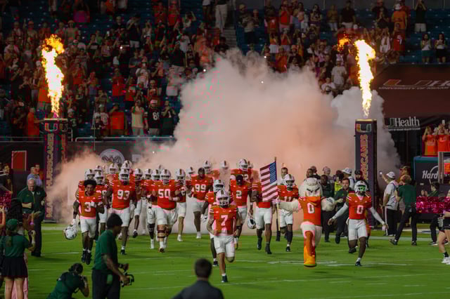 The Miami Hurricanes take the field at Hard Rock Stadium against the Virginia Tech Hokies on Sept. 28, 2024. // Photo Credit via Emily Rice
