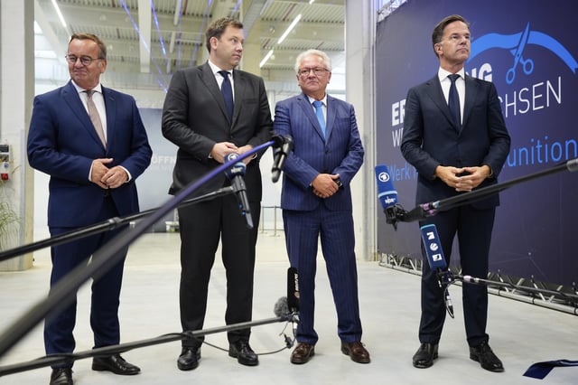 German Defense Minister Boris Pistorius, from left, German Vice Chancellor Lars Klingbeil, CEO Armin Papperger and NATO Secretary General Mark Rutte wait for questions of journalists after the official opening a newly built artillery ammunition plant by German arms manufacturer Rheinmetall in Unterluess, Germany, Wednesday, Aug. 27, 2025. (AP Photo/Markus Schreiber)
